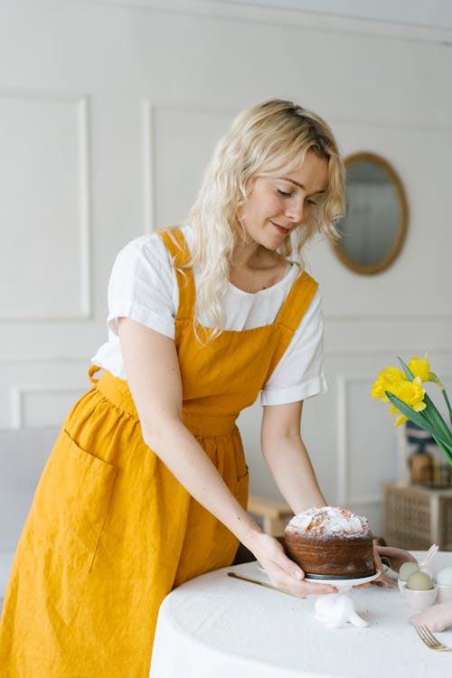 Free Woman in White Shirt and Yellow Skirt Holding Cake Stock Photo