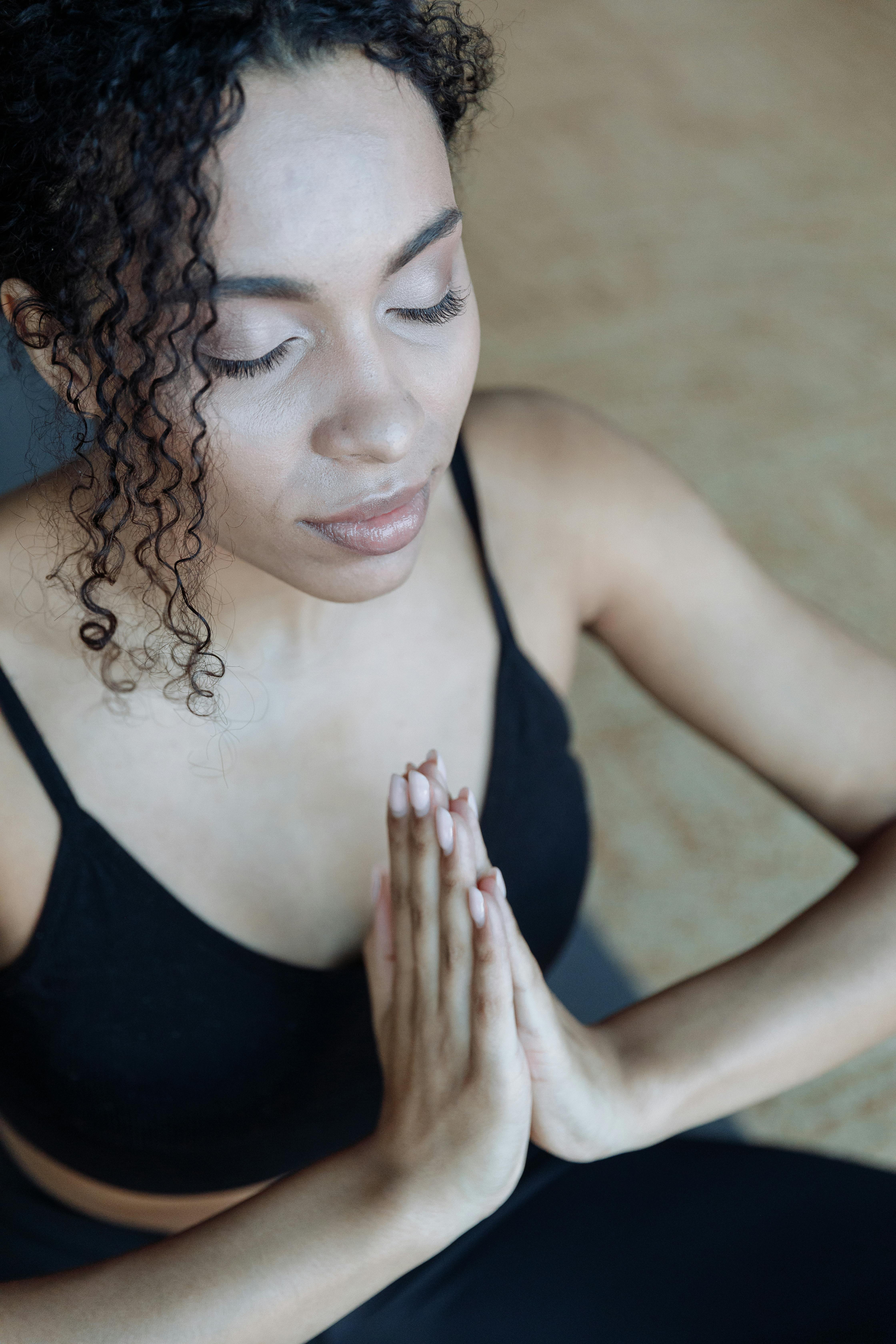 Woman Meditating with Her Eyes Closed