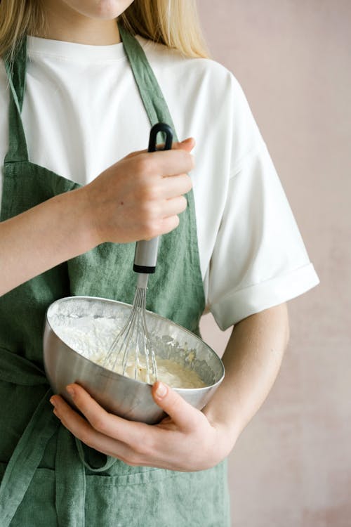 Free Female mixing ingredients in bowl with whisk Stock Photo