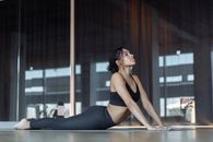 Woman Stretching on the Floor