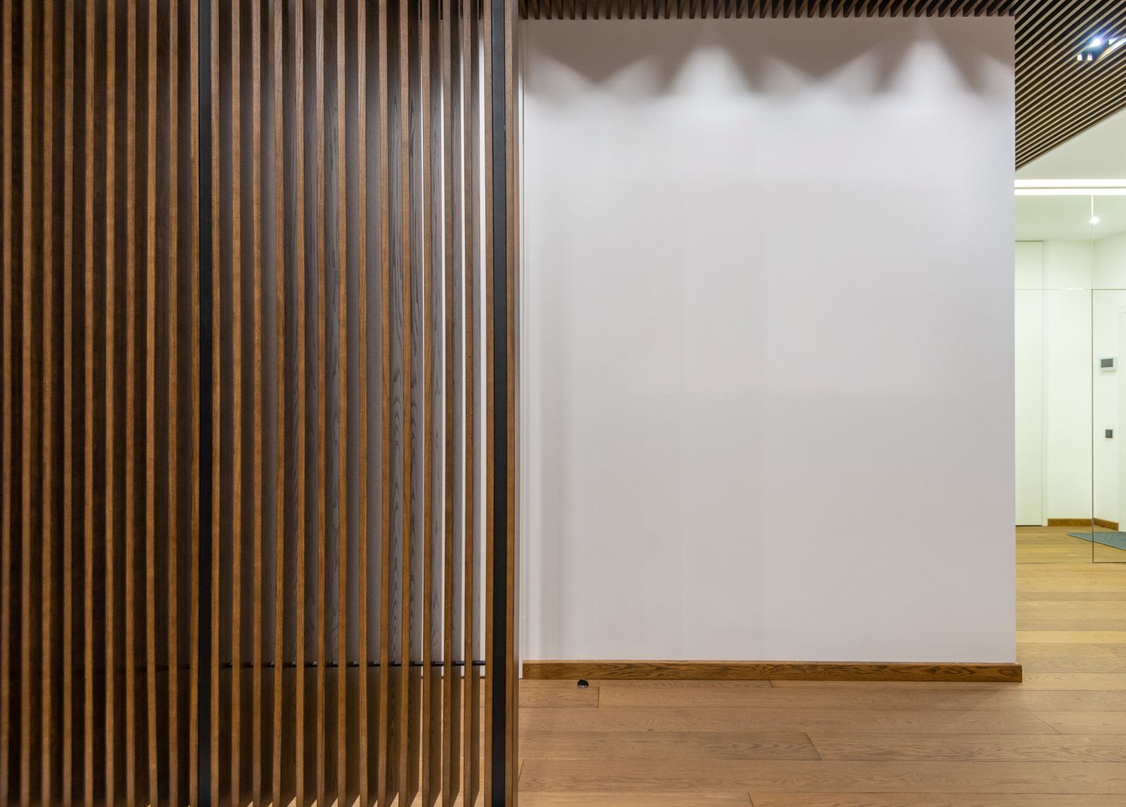 Corridor lined with thin wooden partitions — photo by Max Vakhtbovych on Pexels