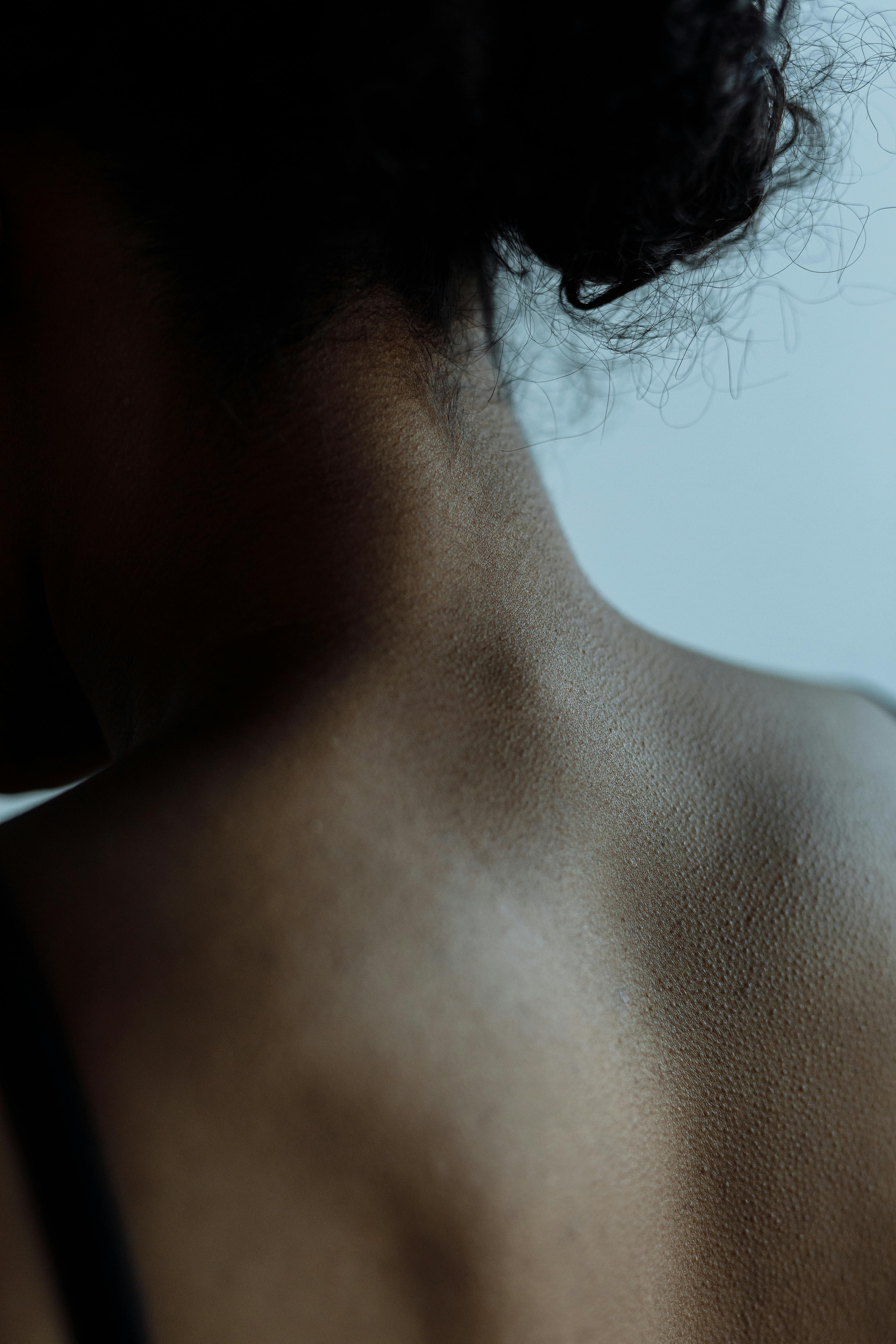 close up photo of a shirtless woman s back