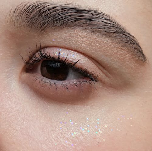 Foto profissional grátis de cílios, close-up, maquiagem com glitter