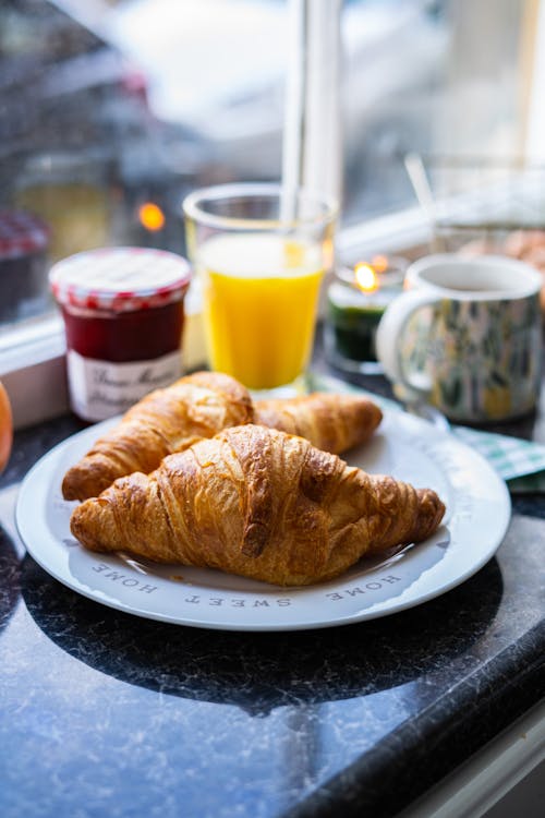 Free Croissant Breads on a Ceramic Plate Stock Photo