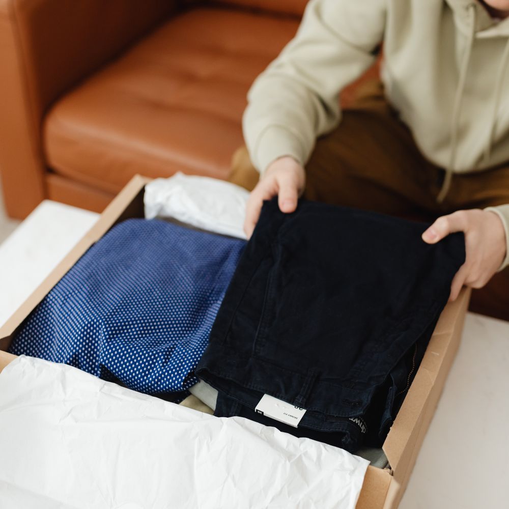 Tempsford — movers carrying boxes for a flat move