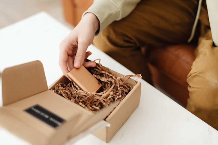 Man Unpacking A Package 