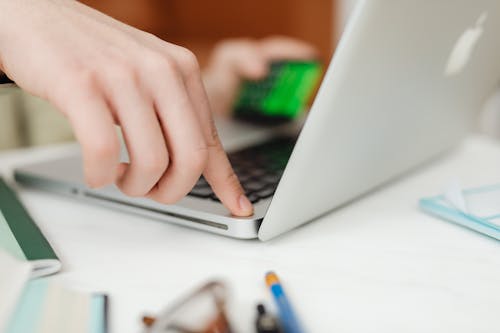 Close up of a Person Using a Laptop