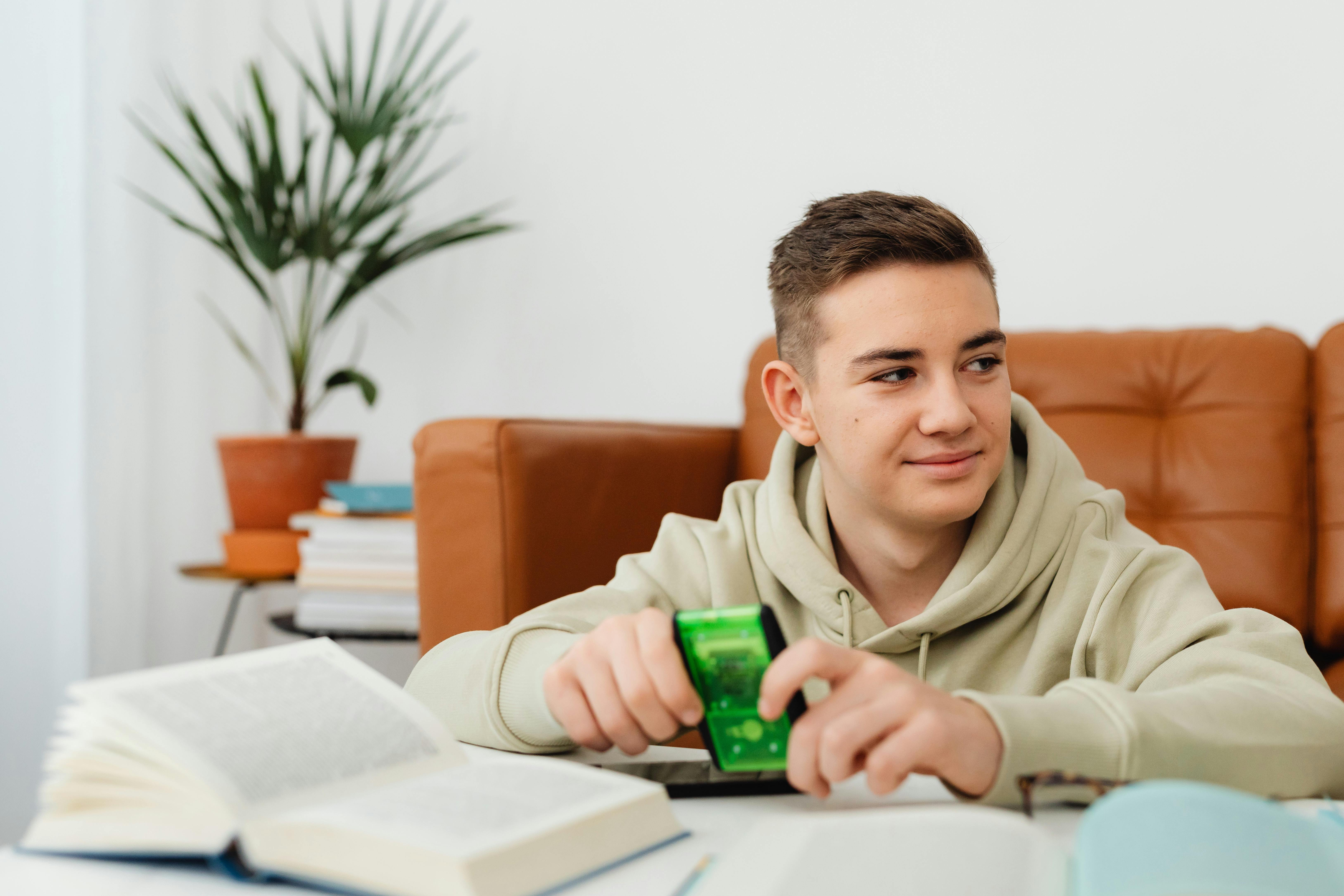 young man holding a calculator