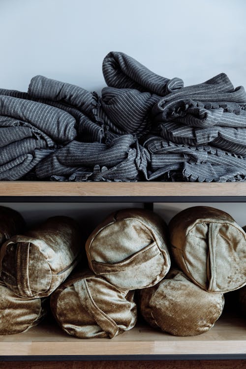 Free Clothes on Wooden Shelves Stock Photo