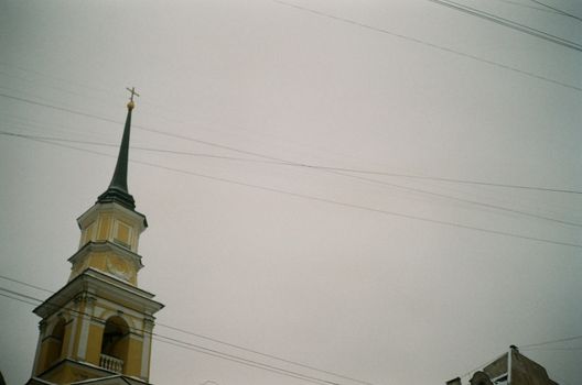 Fragment of historic church against cloudy sky