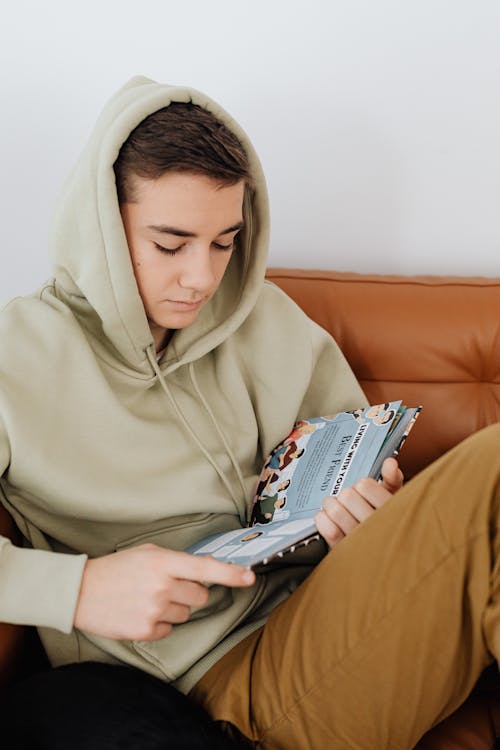A Young Man Reading a Book