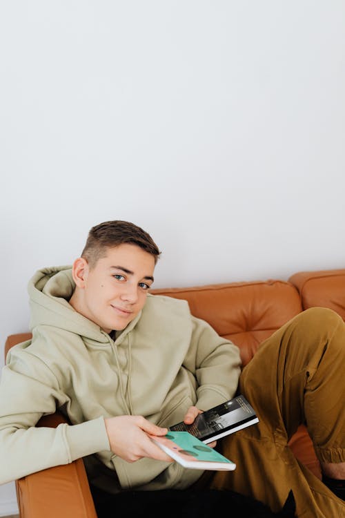 Boy with Books on Couch