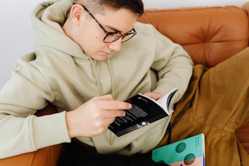 Free Fine Looking Young Man Reading a Book Stock Photo