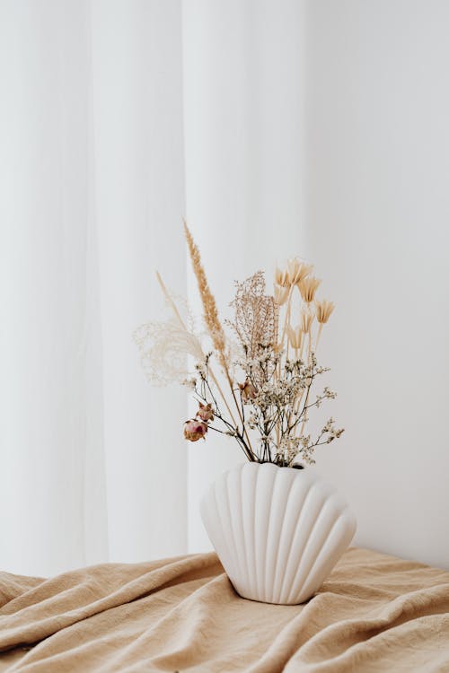 Dried Flowers on White Ceramic Vase