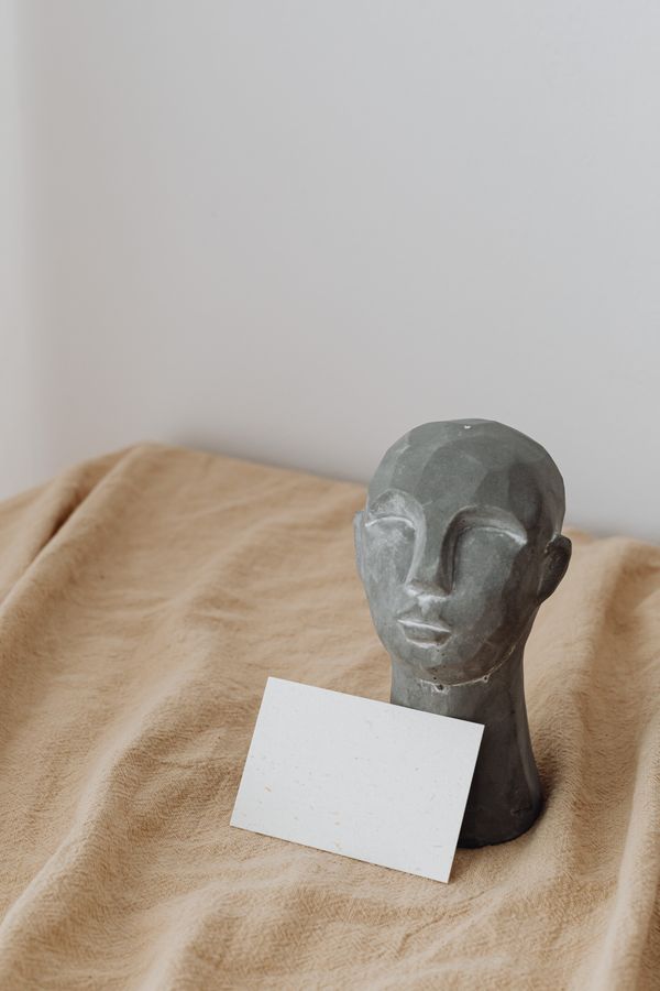 Minimalist sculpture on draped fabric, by kaboompics.com on Pexels