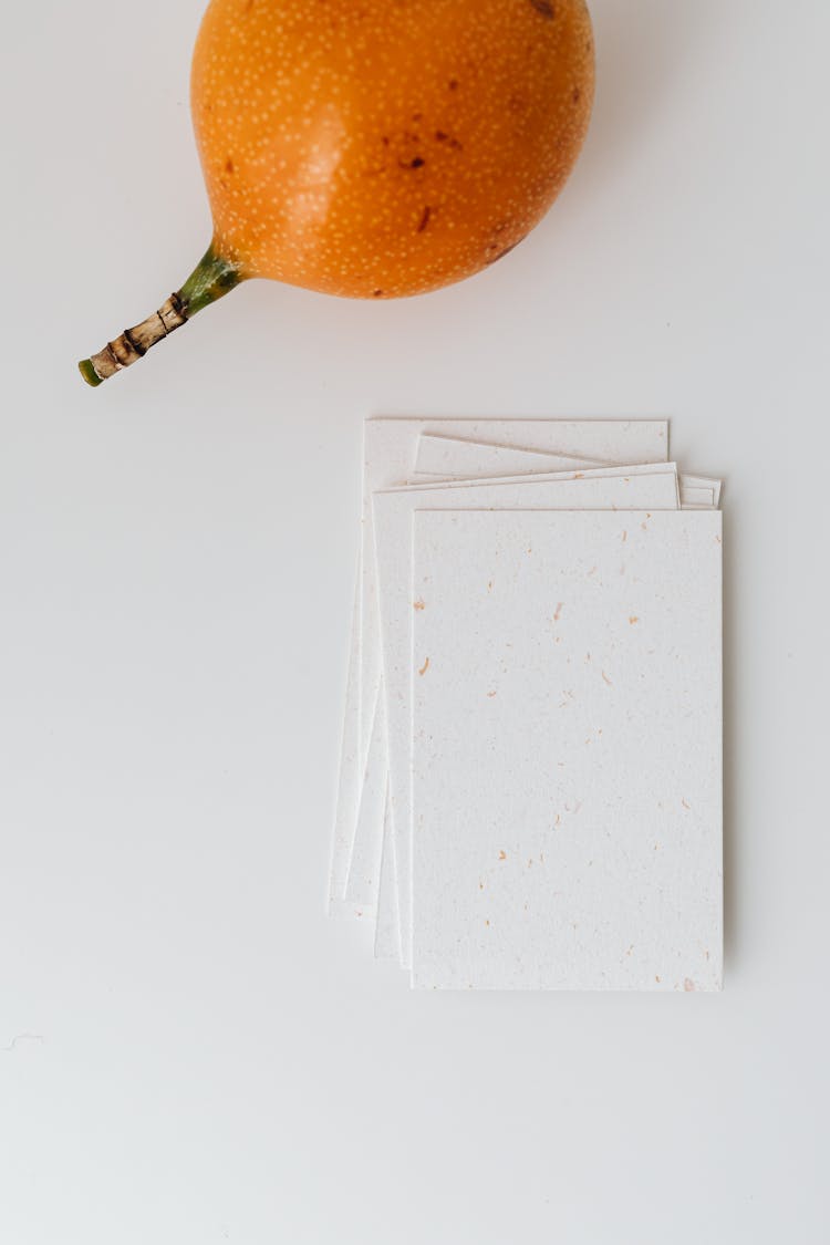 Postcards And Fruit On White Background