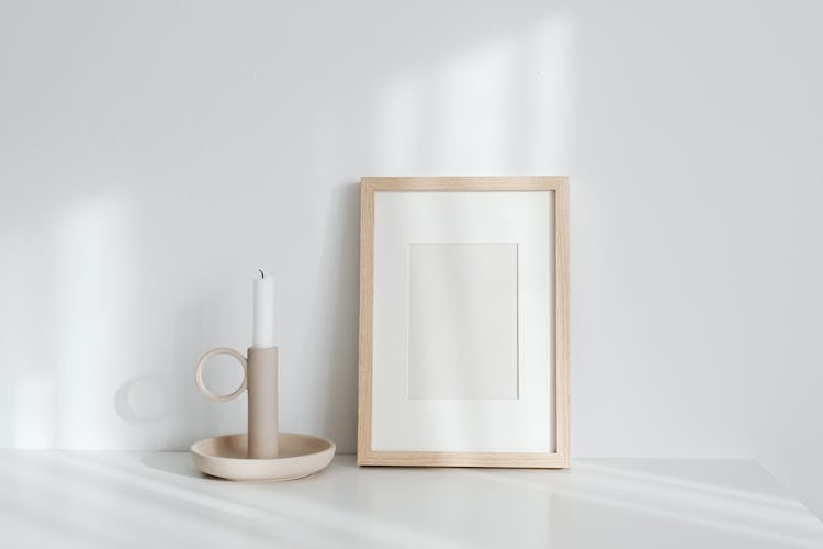 Blank Picture Frame Next To Candle