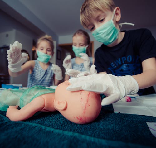 Three Children Playing Operation Toy