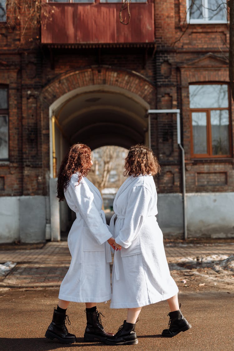 Women In White Robe Walking On Street