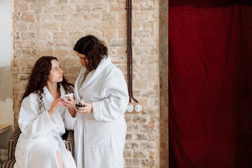 Man and Woman in White Robe Kissing