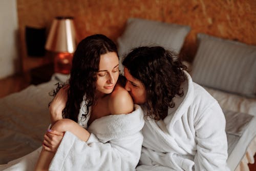 Woman Kissing the Shoulder of Another Woman