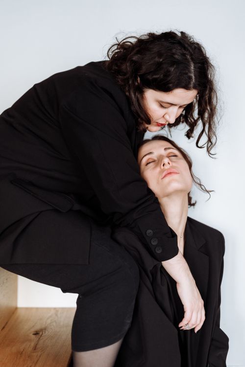 Free A tender embrace between two women, showcasing love and affection in a stylish indoor setting. Stock Photo