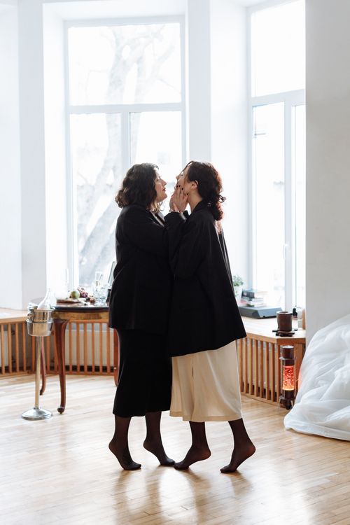 Free A loving couple shares a tender moment indoors, facing each other. Stock Photo