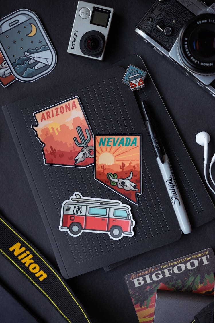 Cool Stickers On Black Table Flat Lay