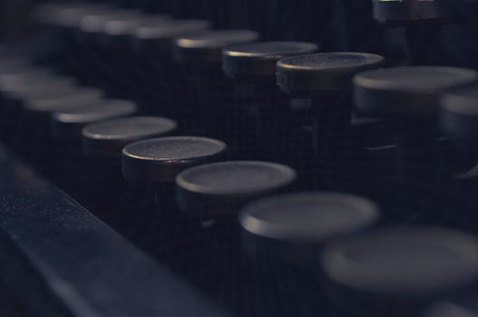 A moody close-up of vintage typewriter keys, capturing the nostalgia and history of antique communication tools.