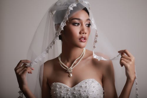 Free A Woman in a Wedding Veil Stock Photo