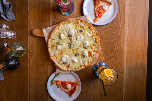 A Whole Pizza on a Wooden Table