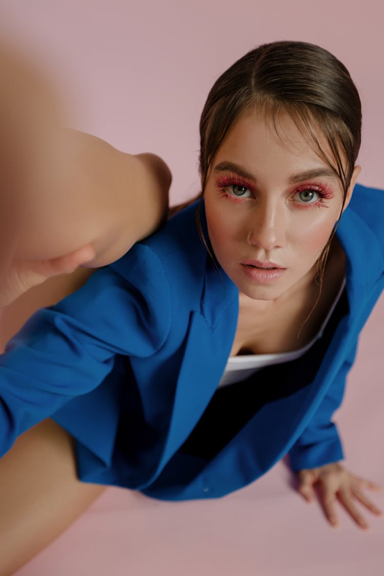 A Woman In Blue Blazer Looking Up