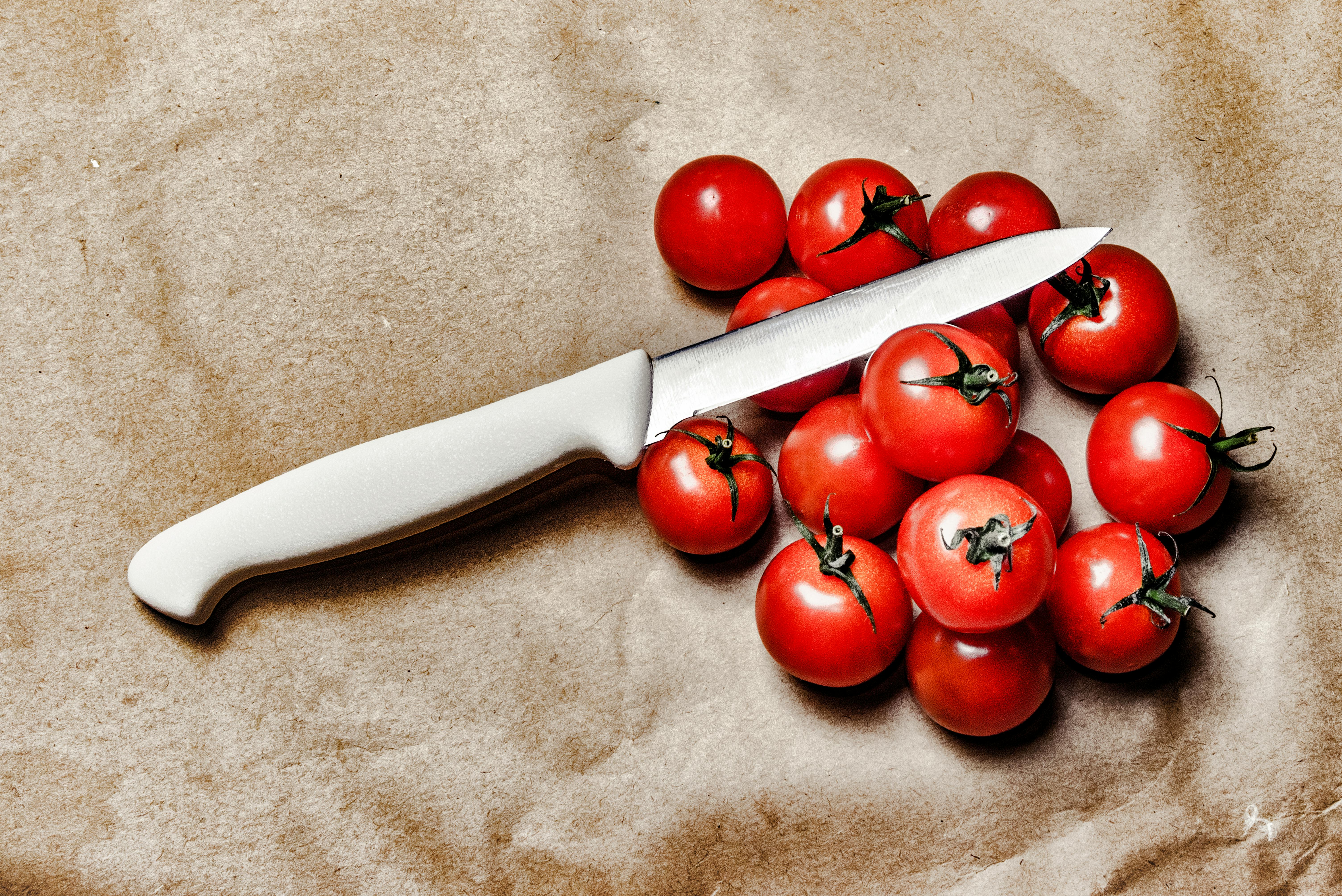 Tomatoes With Knife on Brown Surface · Free Stock Photo