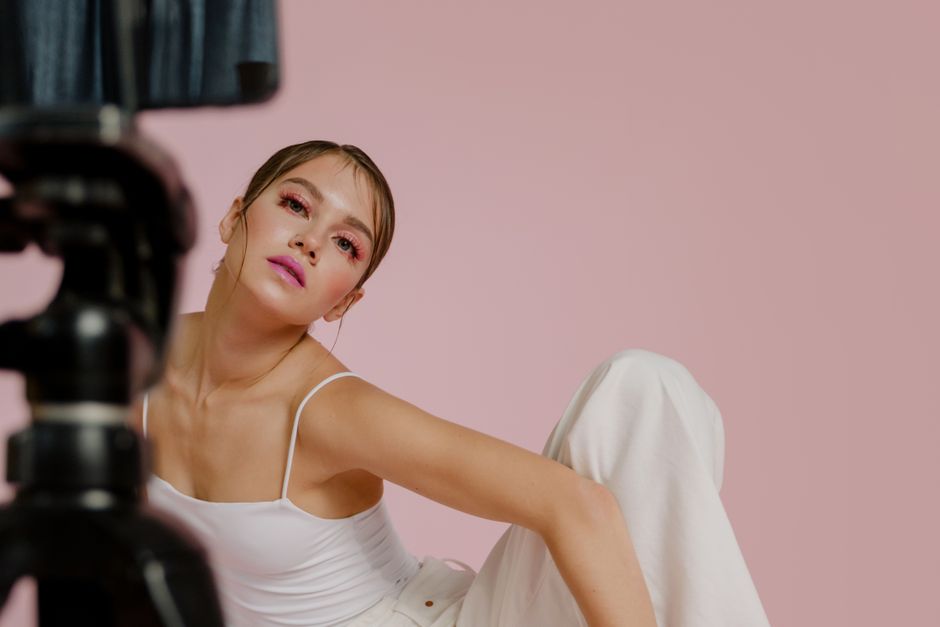 How Micro Influencers Use Media Kit Templates to Land Brand Deals Stylish studio portrait of a woman in a modern pose with soft pink makeup.