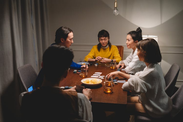 Group Of Gamblers Playing A Card Game