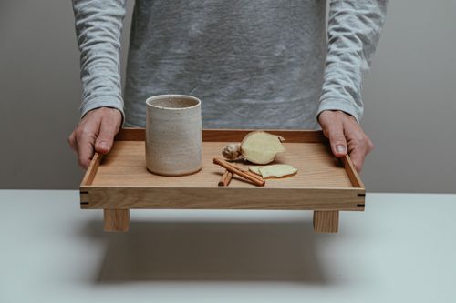 Free Minimalist setup featuring a serving tray with ginger and cinnamon sticks. Perfect for natural wellness themes. Stock Photo