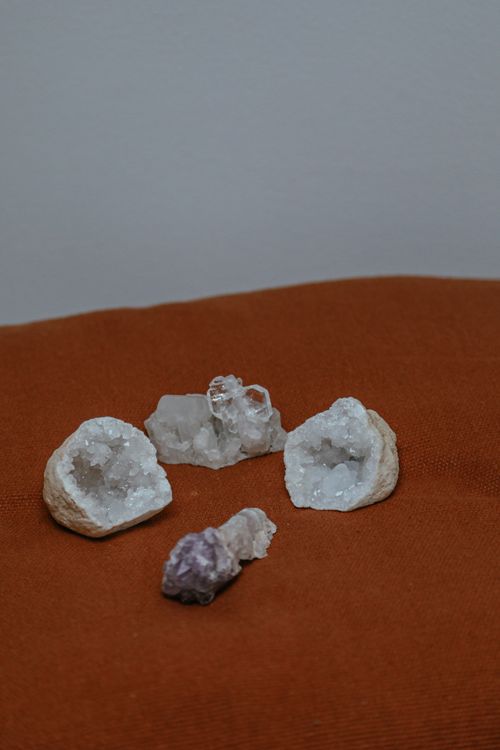crystalline geodes arranged together showing different crystal linings