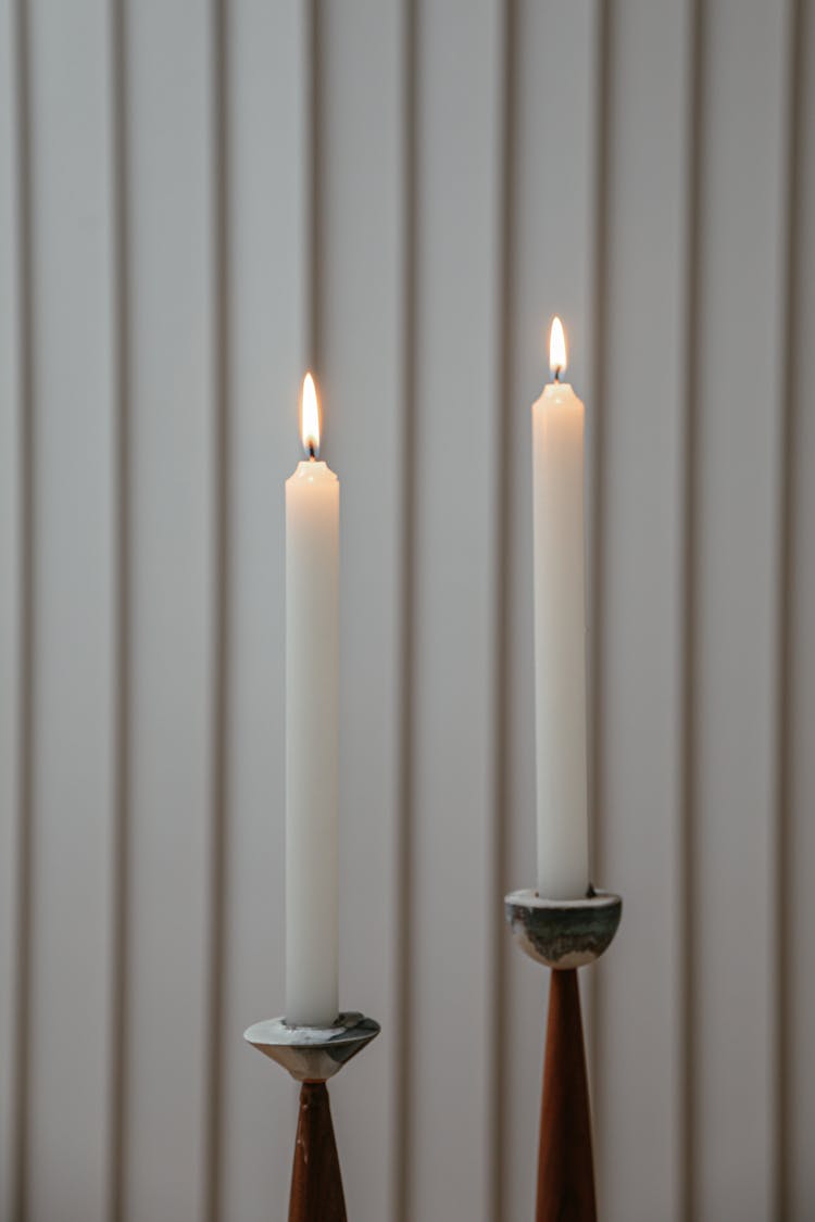 Lit Candles On A Stripes Background