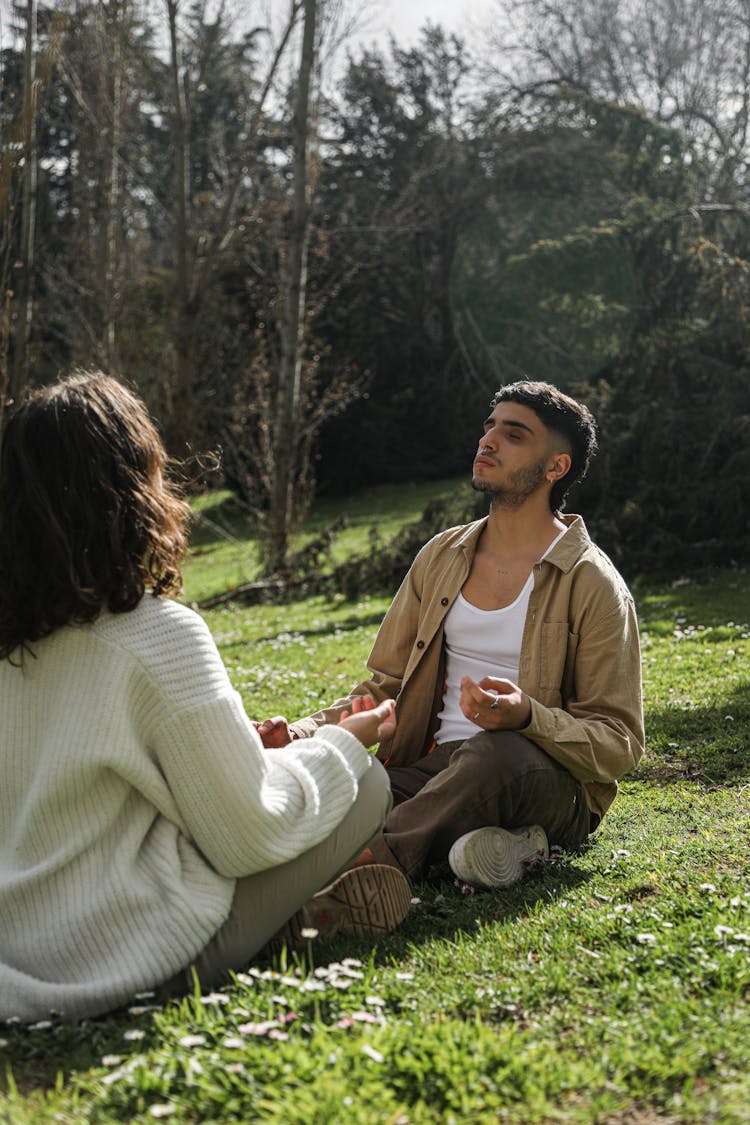 Man And Woman Meditating Together
