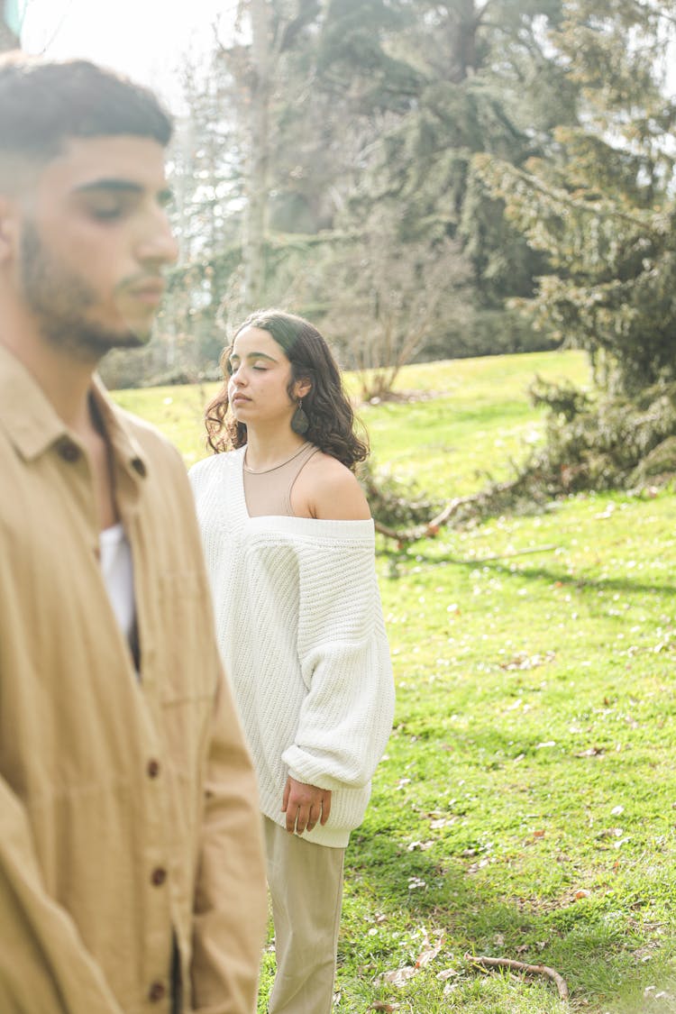 A Couple Meditating While Standing