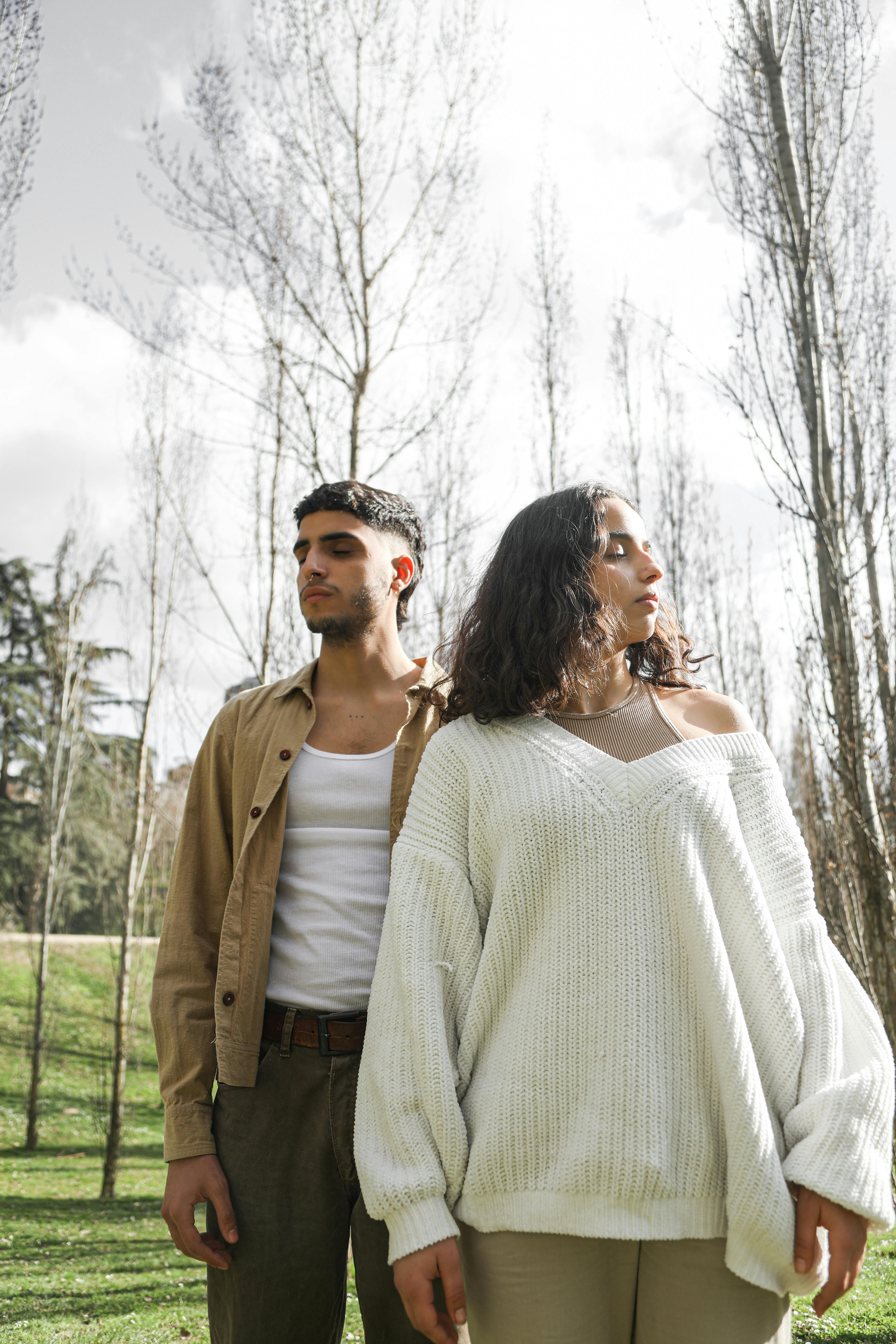 Man and Woman Between Trees · Free Stock Photo
