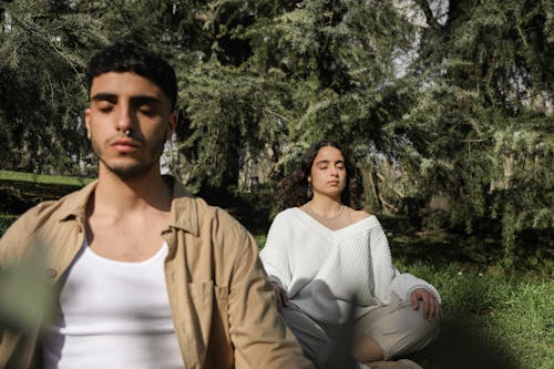 Free Man and Woman Meditating Stock Photo