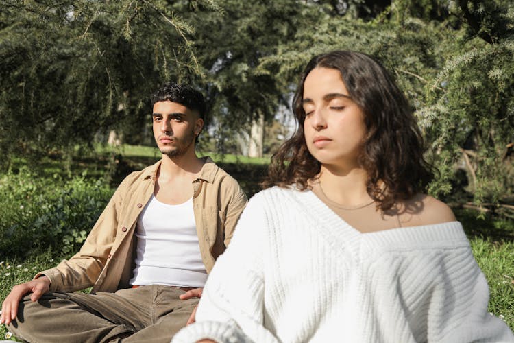 A Man And Woman Doing Yoga 