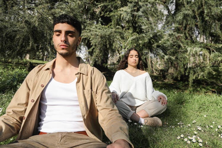 A Man And Woman Doing Yoga