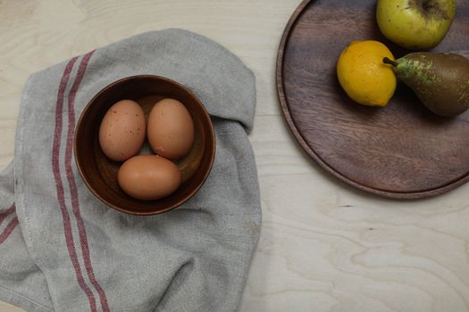 Brown Eggs in a Bowl  Beside Fruits on Tray