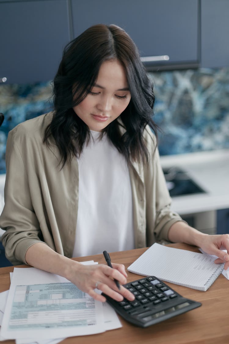 Woman Budgeting Her Bills 