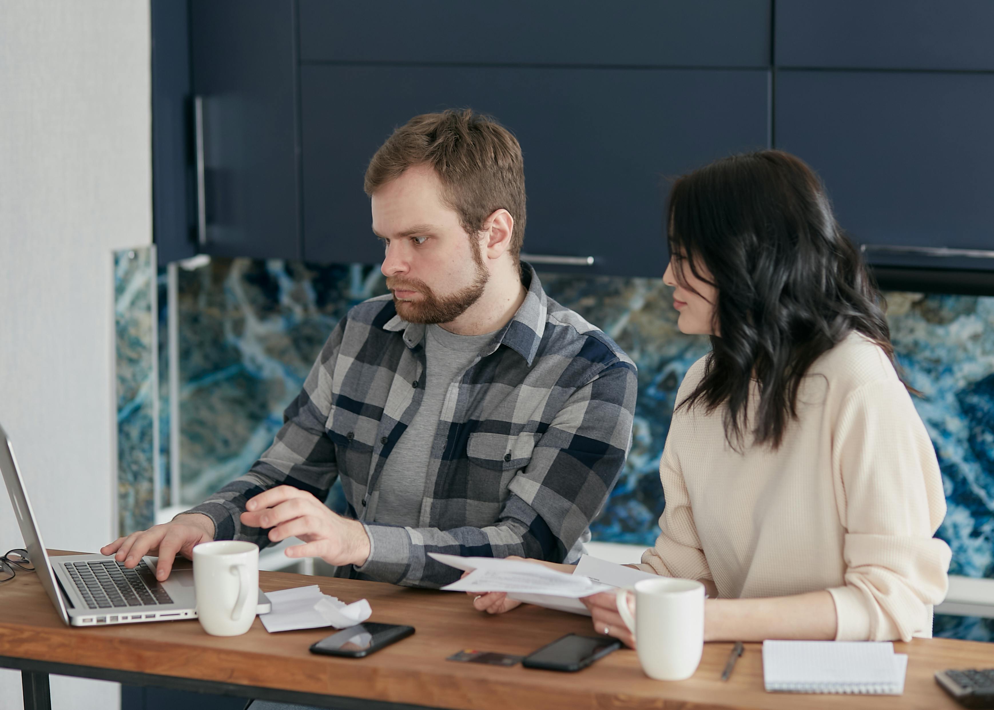 couple people coffee desk