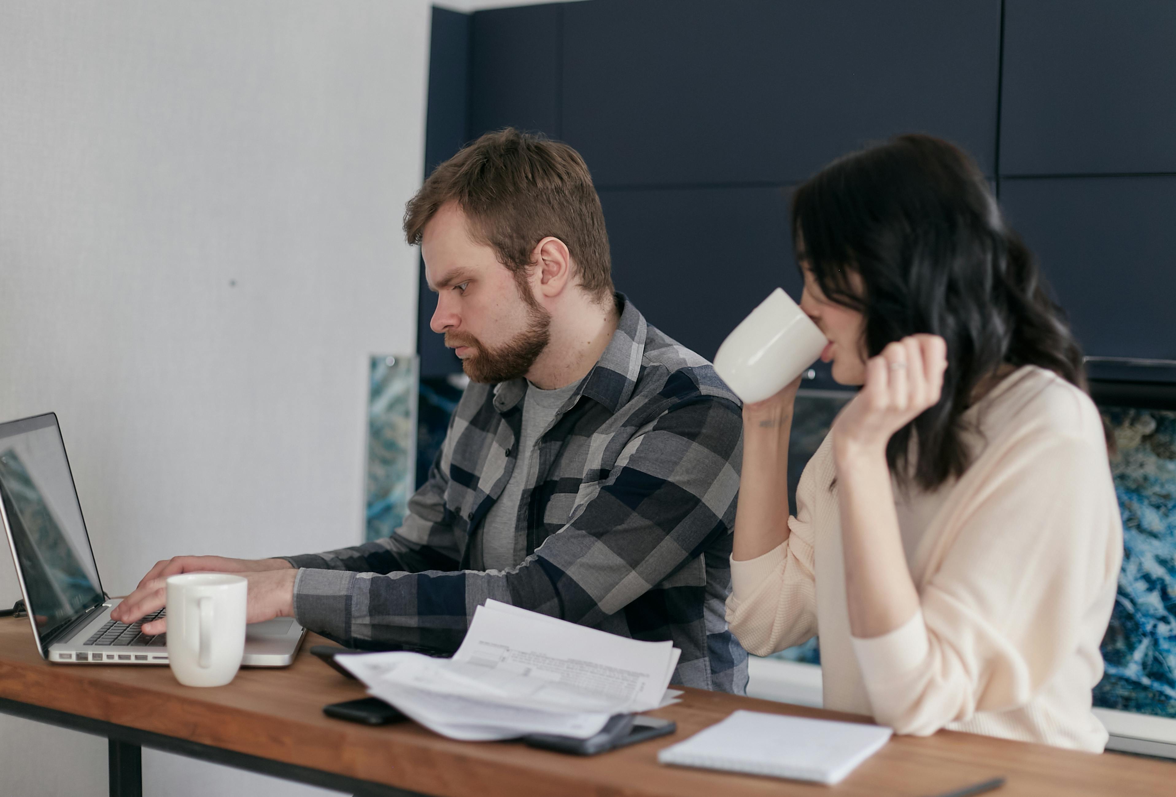 couple people coffee desk