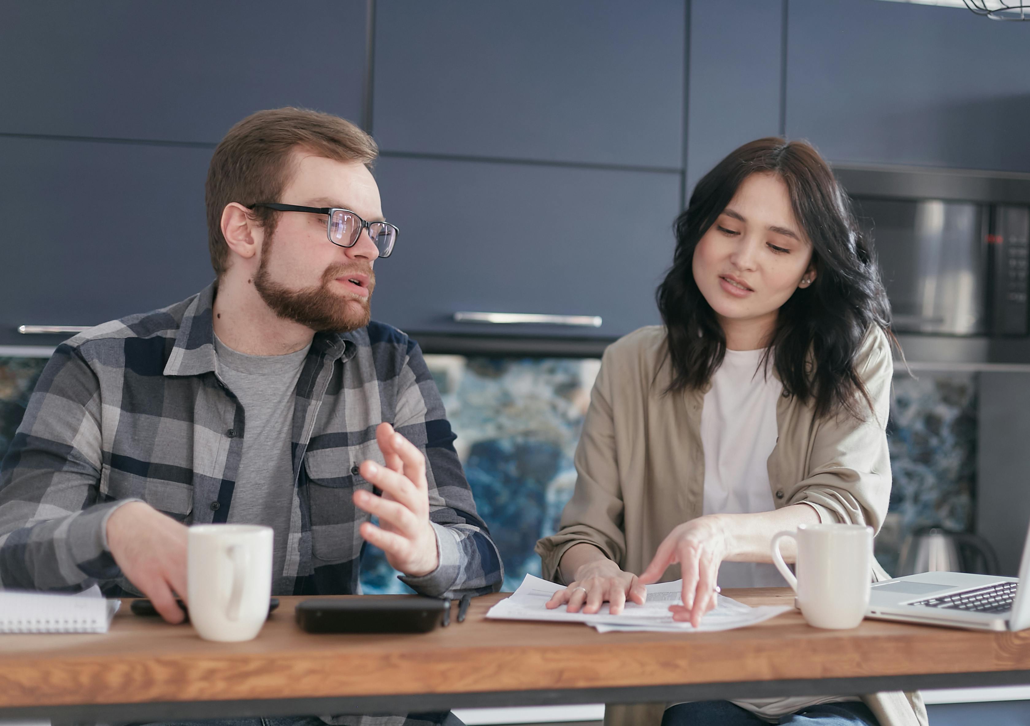 man and woman sitting at table