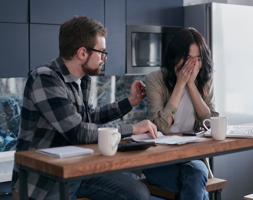 Woman organizing finances at home after major life change. Shot by Mikhail Nilov